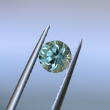 0.85CT ROUND PRECISION CUT MONTANA SAPPHIRE, LIGHT GREEN YELLOW, 5.55X3.70MM
