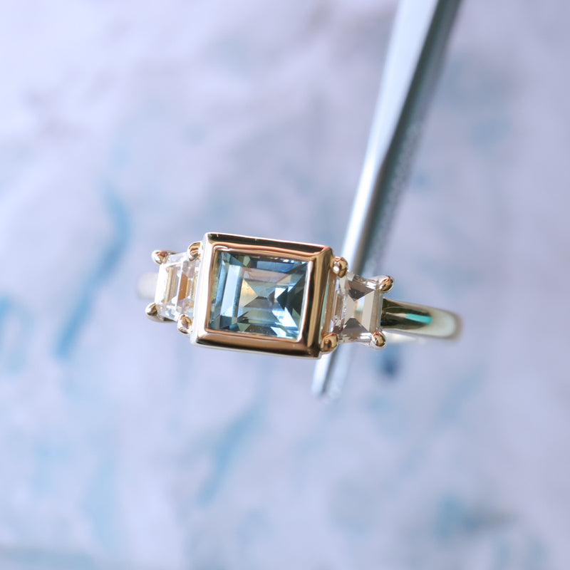 1.06ct Unheated Step Cut Teal Bezel Set Sapphire and White Cadillac Prong Set Sapphire Low Profile Three Stone Ring in 14k Yellow Gold