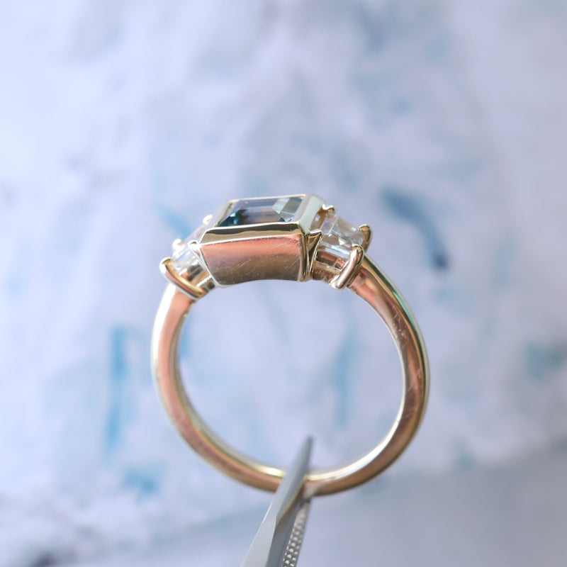 1.06ct Unheated Step Cut Teal Bezel Set Sapphire and White Cadillac Prong Set Sapphire Low Profile Three Stone Ring in 14k Yellow Gold