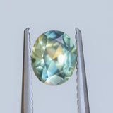 0.65CT OVAL AUSTRALIAN SAPPHIRE, PARTI LIGHT GREEN YELLOW BLUE, UNTREATED, 5.70X4.60X3.30MM