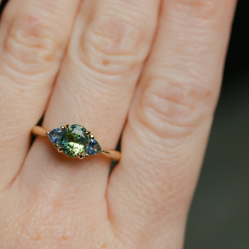 1.61ct Oval Madagascar Parti Sapphire and Trillion Sapphire Three Stone Low Profile Ring in 14k Yellow Gold