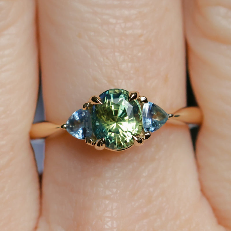 1.61ct Oval Madagascar Parti Sapphire and Trillion Sapphire Three Stone Low Profile Ring in 14k Yellow Gold
