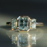1.29ct Bezel Set Emerald Cut Untreated Montana Sapphire and Montana Sapphire Sides Three Stone Ring in 14k Yellow Gold