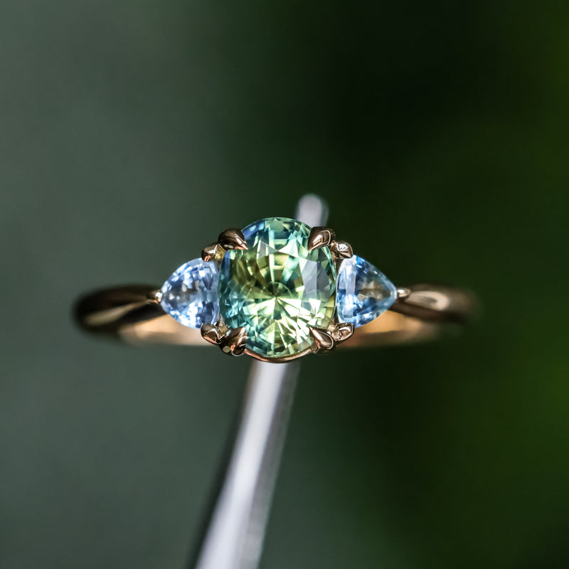 1.61ct Oval Madagascar Parti Sapphire and Trillion Sapphire Three Stone Low Profile Ring in 14k Yellow Gold
