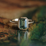 2.62ct Teal Green Emerald Cut Sapphire Low Profile Bezel Ring in 14k Yellow Gold