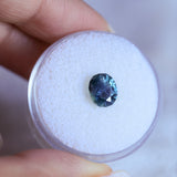 1.73CT PRECISION CUT OVAL MONTANA SAPPHIRE, DENIM PARTI TEAL WITH EARTHY INCLUSIONS, 7.47X6.16X4.69MM