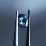 1.73CT PRECISION CUT OVAL MONTANA SAPPHIRE, DENIM PARTI TEAL WITH EARTHY INCLUSIONS, 7.47X6.16X4.69MM