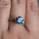 1.73CT PRECISION CUT OVAL MONTANA SAPPHIRE, DENIM PARTI TEAL WITH EARTHY INCLUSIONS, 7.47X6.16X4.69MM