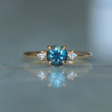 1.10ct Round Deep Teal Montana Sapphire and Princess Cut Diamond Rapids Low Profile Ring in 14k Yellow Gold