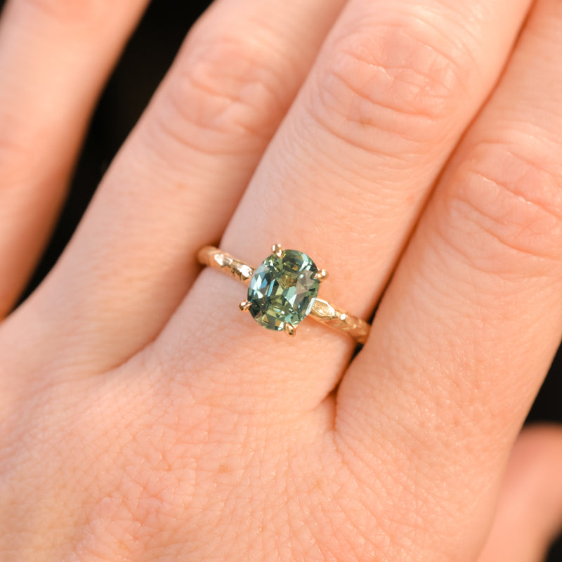 1.74ct Oval Untreated Blue Madagascar Sapphire Four Prong Evergreen Solitaire in 14k Yellow Gold