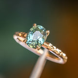 1.74ct Oval Untreated Blue Madagascar Sapphire Four Prong Evergreen Solitaire in 14k Yellow Gold