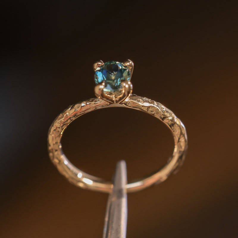 0.85ct Oval Precision Cut Ocean Blue Montana Sapphire Evergreen Carved 4 Prong Solitaire in 14k Yellow Gold