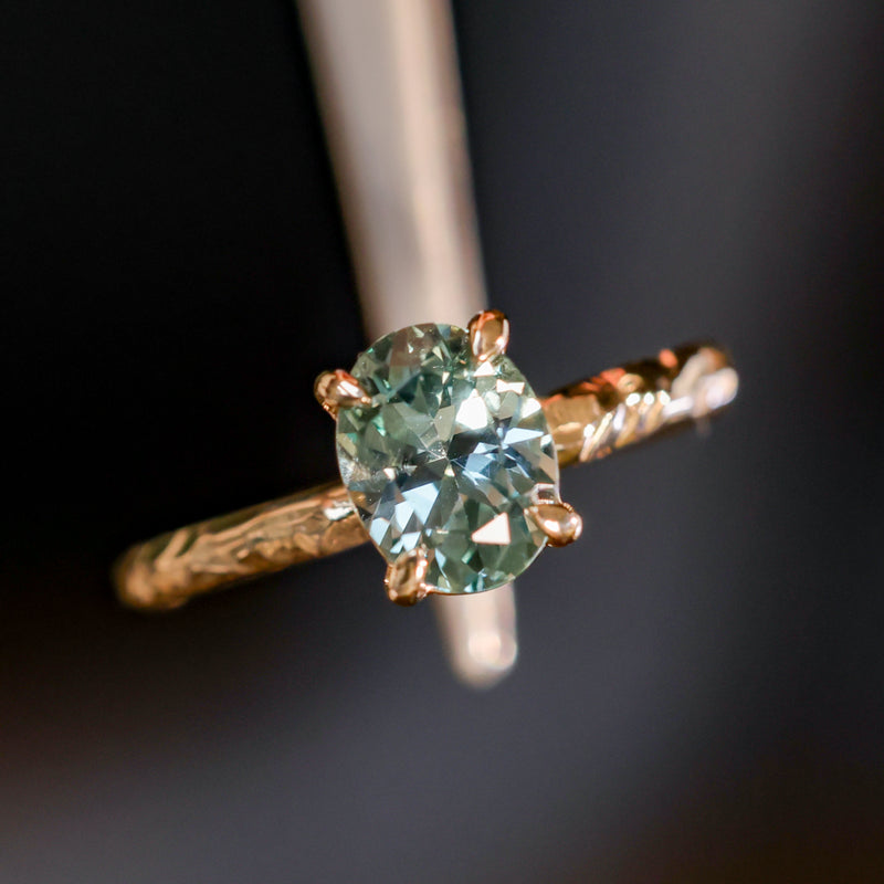 1.58ct Oval Untreated Light Blue Montana Sapphire Evergreen Carved 4 Prong Solitaire in 14k Yellow Gold