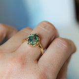 3.29ct Untreated Oval Parti Green Sapphire Low Profile 6 Prong Evergreen Carved Solitaire in 14k Yellow Gold