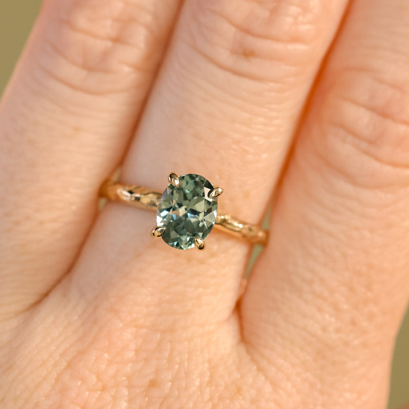 1.58ct Oval Untreated Light Blue Montana Sapphire Evergreen Carved 4 Prong Solitaire in 14k Yellow Gold