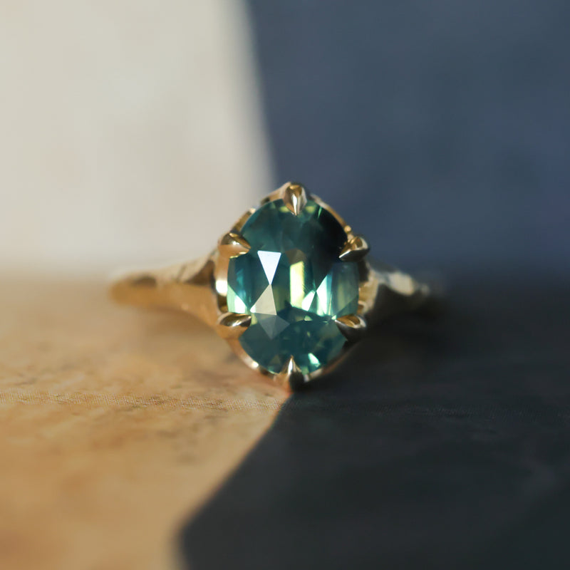 3.29ct Untreated Oval Parti Green Sapphire Low Profile 6 Prong Evergreen Carved Solitaire in 14k Yellow Gold