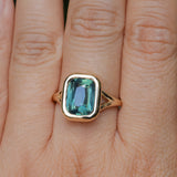4.09ct Elongated Cushion Cut Teal Sapphire Low Profile Split Shank Bezel Ring in 14k Yellow Gold- Appraised Stone