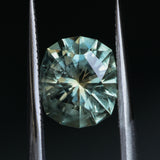 2.57CT FANCY PRECISION CUSHION MONTANA SAPPHIRE, PARTI OLIVE GREEN AND GOLD, 8.82X7.54X5.37MM - APPRAISED STONE