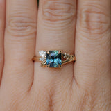 1.65ct Teal Blue Radiant Cut Madagascar Sapphire in Wandering Vine Low Profile 4 Prong Setting with Diamonds in 14k Yellow