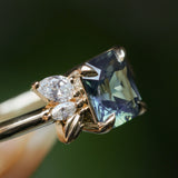 1.65ct Teal Blue Radiant Cut Madagascar Sapphire in Wandering Vine Low Profile 4 Prong Setting with Diamonds in 14k Yellow