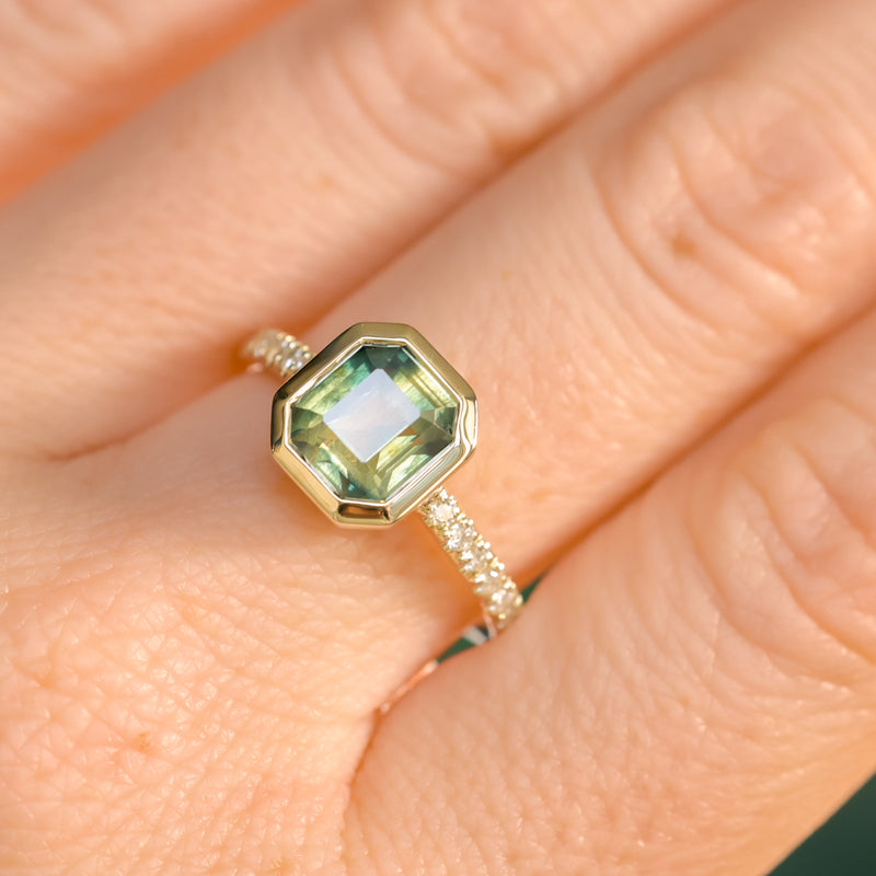 2.18ct Emerald Cut Parti Madagascar Sapphire Low Profile Bezel Solitaire Ring with Pavé Set Diamonds in 14k Green Gold