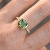 2.18ct Emerald Cut Parti Madagascar Sapphire Low Profile Bezel Solitaire Ring with Pavé Set Diamonds in 14k Green Gold