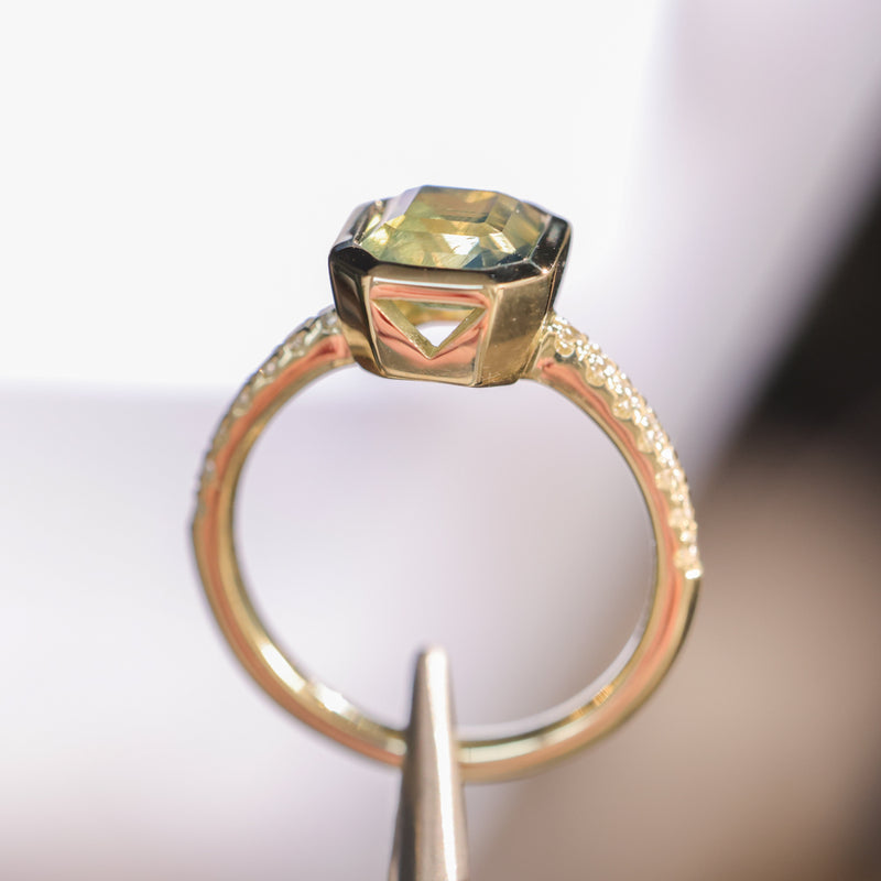 2.18ct Emerald Cut Parti Madagascar Sapphire Low Profile Bezel Solitaire Ring with Pavé Set Diamonds in 14k Green Gold