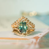 3.29ct Untreated Oval Parti Green Sapphire Low Profile 6 Prong Evergreen Carved Solitaire in 14k Yellow Gold