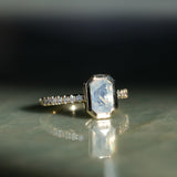 2.10ct Untreated Opalescent Radiant Cut Sapphire Low Profile Bezel Solitaire Ring with Pavé Set Diamonds in 14k Yellow Gold