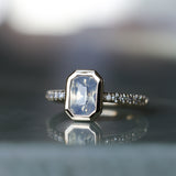 2.10ct Untreated Opalescent Radiant Cut Sapphire Low Profile Bezel Solitaire Ring with Pavé Set Diamonds in 14k Yellow Gold