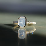 2.10ct Untreated Opalescent Radiant Cut Sapphire Low Profile Bezel Solitaire Ring with Pavé Set Diamonds in 14k Yellow Gold