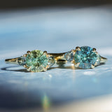 1.82ct Round Teal Precision Cut Montana Sapphire and Trillion Sapphire Low Profile Three Stone Ring in 18k Yellow Gold