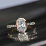 2.10ct Untreated Opalescent Radiant Cut Sapphire Low Profile Bezel Solitaire Ring with Pavé Set Diamonds in 14k Yellow Gold