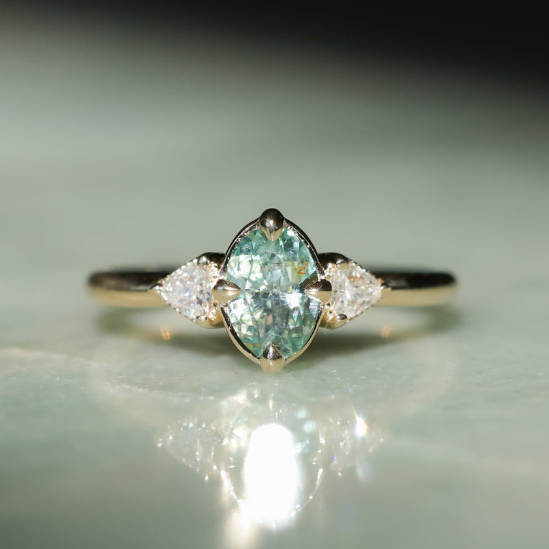 0.73ct Oval Unheated Montana Sapphire and Trillion Diamond Low Profile Ring in 14k Yellow Gold