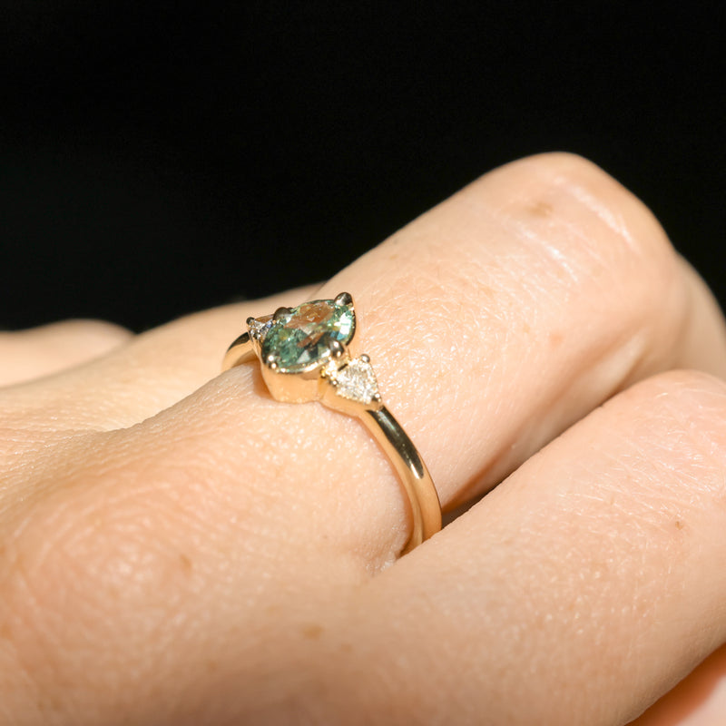 0.73ct Oval Unheated Montana Sapphire and Trillion Diamond Low Profile Ring in 14k Yellow Gold