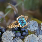 2.15ct Emerald Cut Madagascar Sapphire Wandering Vine Low Profile Bezel Split Shank Ring in 14k Yellow Gold