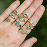 0.73ct Oval Unheated Montana Sapphire and Trillion Diamond Low Profile Ring in 14k Yellow Gold