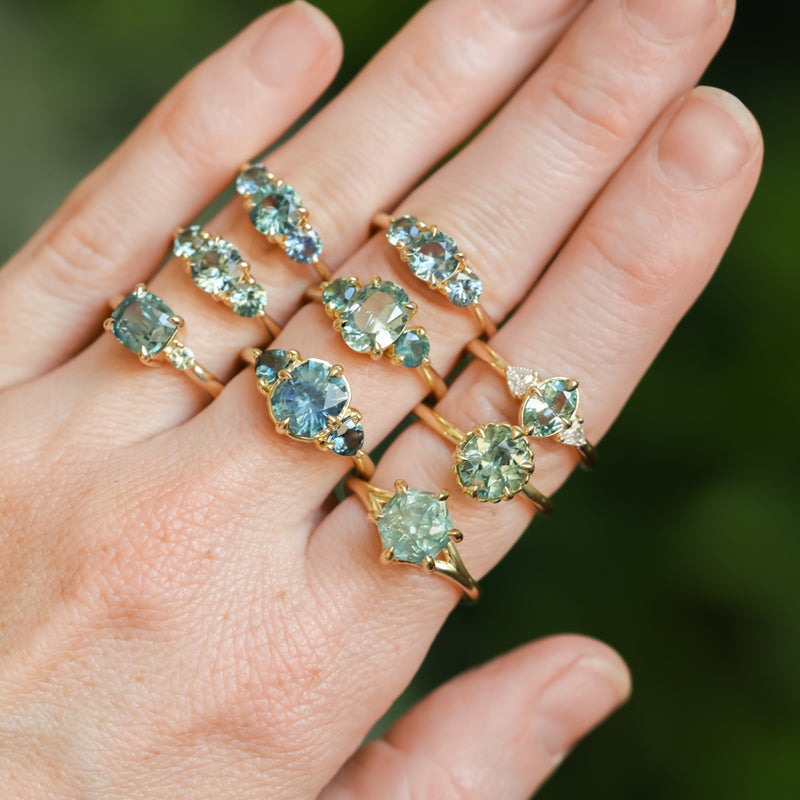 0.73ct Oval Unheated Montana Sapphire and Trillion Diamond Low Profile Ring in 14k Yellow Gold