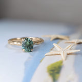 1.75ct Precision Cut Teal Oval Montana Sapphire Four Prong Evergreen Hidden Halo Solitaire in 14k Yellow Gold