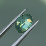 2.82CT OVAL MADAGASCAR SAPPHIRE, CARIBBEAN TEAL GREEN WITH GROWTH LINES, 8.94X6.75X5.50MM