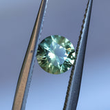 1.08CT ROUND PRECISION CUT MONTANA SAPPHIRE, LIGHT GREEN YELLOW, 5.9X4.03MM