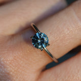 1.39CT ROUND PRECISION CUT MONTANA SAPPHIRE, COLOR SHIFTING TEAL TO PURPLE GREY, 6.5X4.3MM