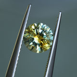 1.39CT ROUND PRECISION CUT MONTANA SAPPHIRE, BICOLOR YELLOW BLUE, 6.6X4.3MM