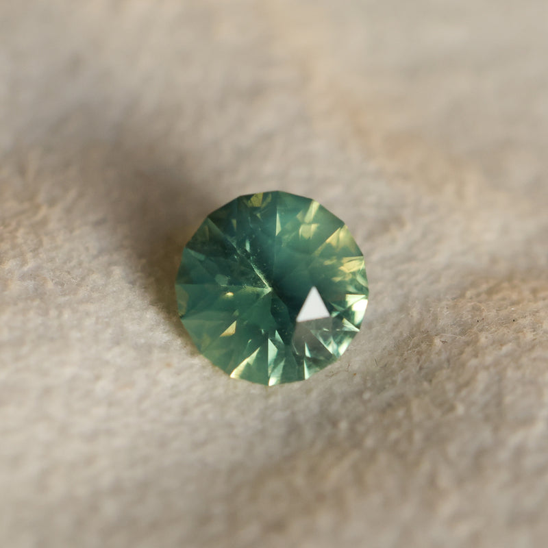 1.29CT ROUND MADAGASCAR SAPPHIRE, SILKY YELLOW GREEN PARTI, UNTREATED, 6.4X4.22MM