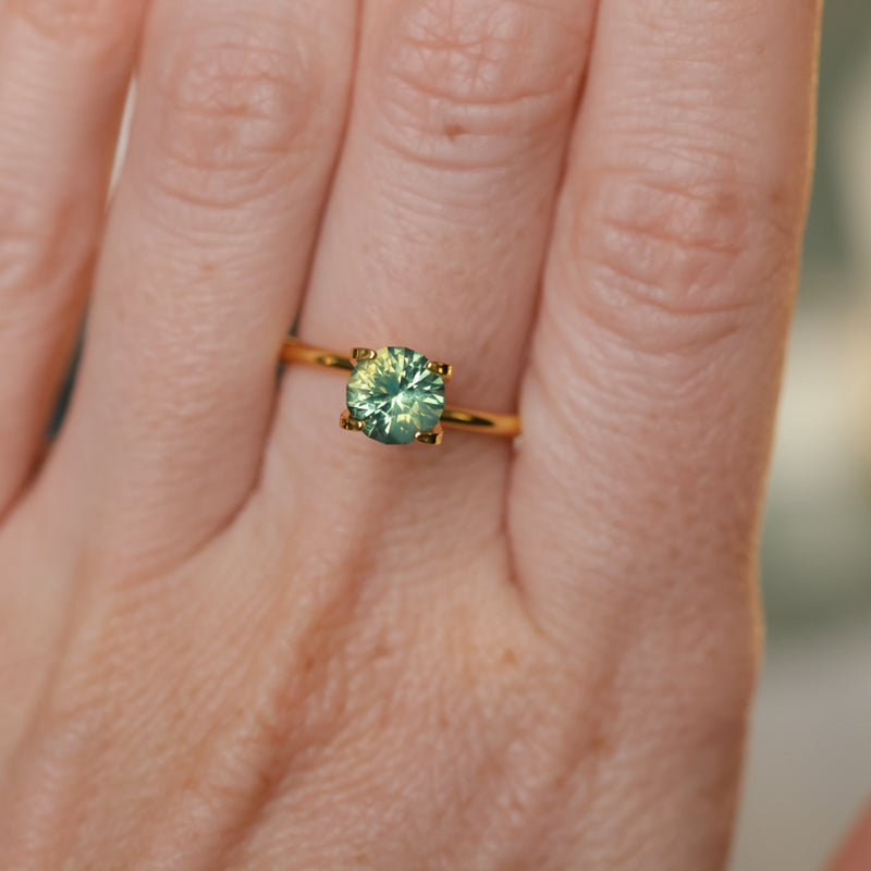 1.29CT ROUND MADAGASCAR SAPPHIRE, SILKY YELLOW GREEN PARTI, UNTREATED, 6.4X4.22MM