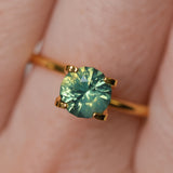 1.29CT ROUND MADAGASCAR SAPPHIRE, SILKY YELLOW GREEN PARTI, UNTREATED, 6.4X4.22MM