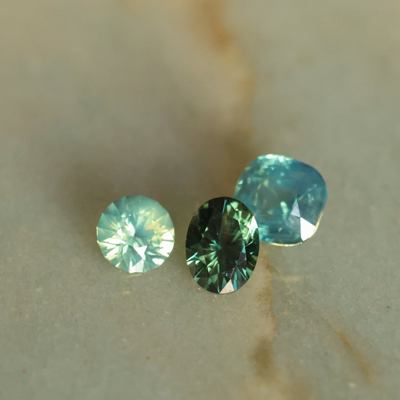 1.29CT ROUND MADAGASCAR SAPPHIRE, SILKY YELLOW GREEN PARTI, UNTREATED, 6.4X4.22MM