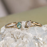 1.20ct Oval Brilliant Teal Montana Sapphire and Princess Cut Diamond Rapids Low Profile Ring in 14k Yellow Gold