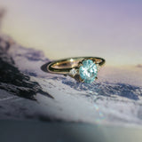 2.01ct Oval Precision Cut Denim Blue Untreated Montana Sapphire and Princess Cut Diamond Rapids Low Profile Ring in 18k Yellow Gold