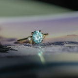 2.01ct Oval Precision Cut Denim Blue Untreated Montana Sapphire and Princess Cut Diamond Rapids Low Profile Ring in 18k Yellow Gold